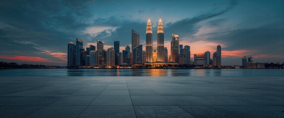 Fototapeta premium Night scene of Kuala Lumpur with beautiful river reflections and an empty concrete square floor