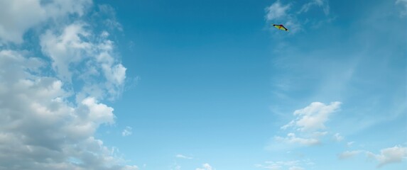 Winter sky with clear air, clouds, and a kite