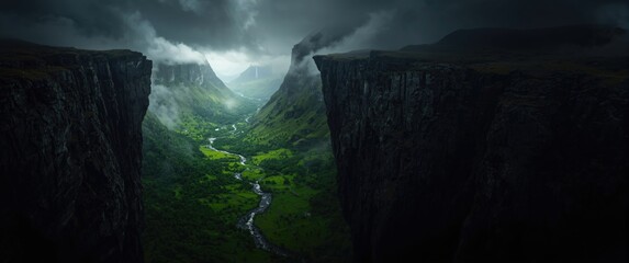 Dark and moody view from the brink of the abyss to a colorful motley mountain valley amidst overcast skies. Highland terrain with dangerous peaks and an abyss beneath a gray sky. Mountain pass in
