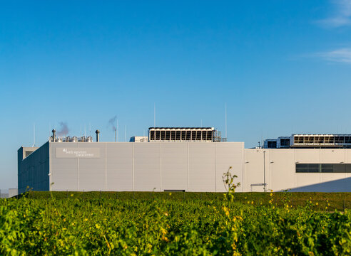 hyper scale AI cloud Datacenter building on a sunny day