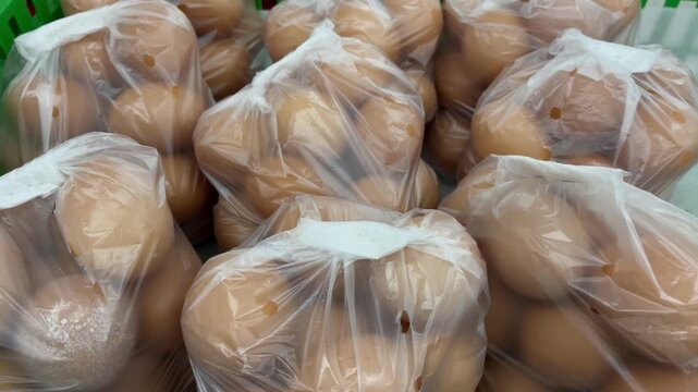 Fresh eggs in transparent plastic bags