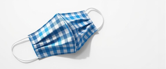 Cloth mask featuring a striped gingham design against a white background or isolated