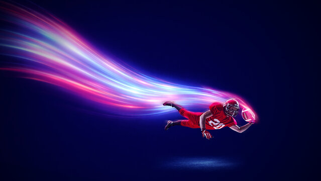 Modern mixed media. American football player diving touchdown with luminous speed trail. Concept of determination emotion, risk, ultimate effort, sports promotion, dynamic creative use.