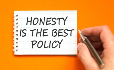 Honesty is the best policy symbol. Concept words Honesty is the best policy on beautiful note. Beautiful orange background. Businessman's hand. Business honesty is the best policy concept. Copy space