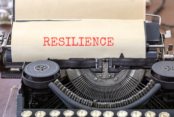 Resilience symbol. Concept word Resilience typed on beautiful old retro typewriter. Beautiful white paper background. Business resilience concept. Copy space.