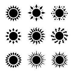 Set of nine black sunburst icons with different rays, arrows and dotted accents, isolated on white. Minimal solar symbols for summer, weather, energy and decoration.