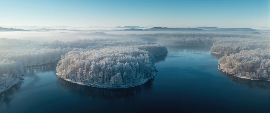 Regional park landscape from above in winter featuring snow, water, sky, and nature