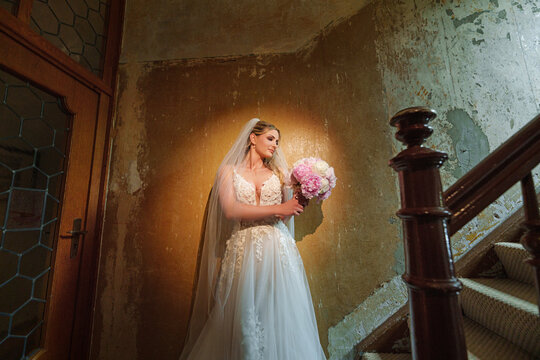  Young bride holding dried flower bouquet
