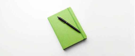White background featuring a green notebook and pen