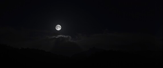 Dark night illuminated by the full moon