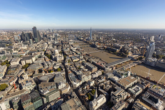 Aerial view of the city's skyline with the modern skyscrapers contrasting against the classic architecture, including St. Paul's Cathedral and Tower Bridge, City of London, London, United Kingdom.