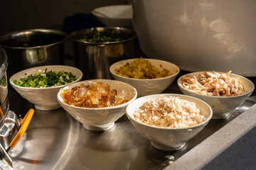 Street market side dishes and toppings for traditional Asian noodle soup, authentic local food culture and travel cuisine concept