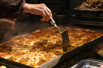 Chef hands preparing Asian street food at local market, authentic travel cuisine and cultural street cooking experience