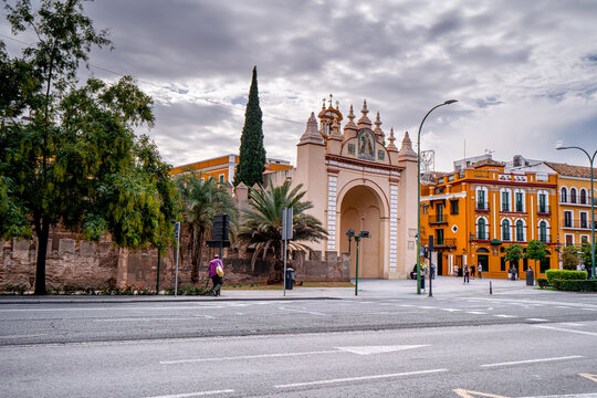 Popular place in Seville, Arco de la Macarena with walking people, Spain. Daily life on Spanish streets city.