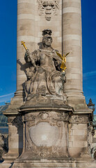 Obraz premium Paris, France - 01 17 2026: detail view of Alexander III bridge with sculpture France under Louis XIV by Laurent Marqueste