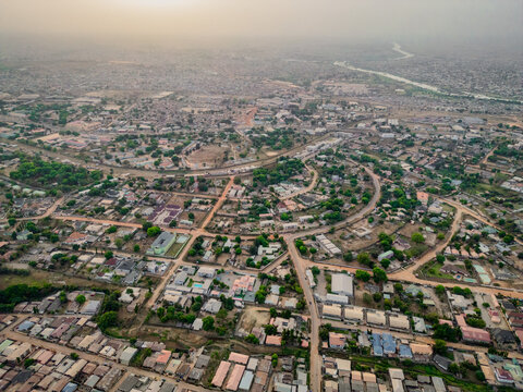 Aerial view of houses and roads interspersed with lush greenery, creating a vibrant contrast against the urban landscape, Kaduna, Kaduna, Nigeria.