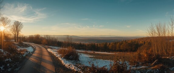 Obraz premium Sunrise over rural landscape with a road and walking path