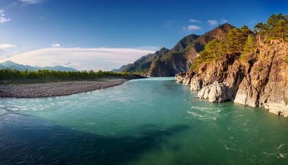 rugged rocky cliff meets katun river along a quiet natural coastline