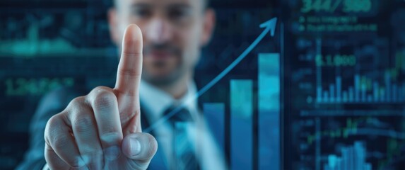 Business investment and profit analysis with businessmanâ€™s finger pointing at the peak bar of a graph