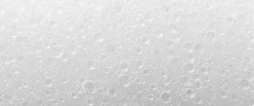 Close-up of white shockproof foam board, featuring synthetic textured background and abstract expanded polyethylene foam sheet with air bubbles for transportation and packaging