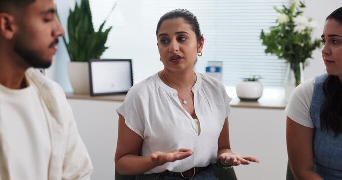 Woman, talking and group therapy for counseling session, employee conflict and staff resolution. People, discussion and comfort for work dispute, interpersonal issues and apologise for HR mediation