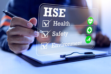health safety environment concept with a safety staff tick check box to manage the work place to complied and meet safety regulation requirement and life quality of staff in employment