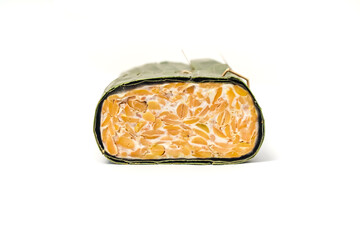 Fermented Tempeh Block with Visible Soybeans and Mold Isolated on White Background