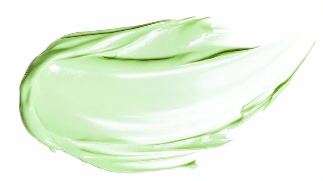 A single vibrant green mint leaf captured in mid-air against a stark white backdrop, conveying a sense of freshness and vitality.