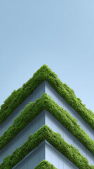 Modern green architecture showing sustainable vertical garden on building facade. This eco friendly design concept promotes feeling of calm against clear blue sky