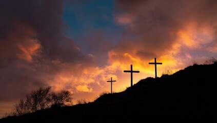 Obraz premium Three crosses stand silhouetted against a dramatic, colorful sunset sky, evoking a sense of solemnity and spiritual reflection. ..Created with Generative AI, not depicting real subjects.