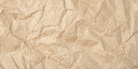 Fototapeta premium The texture of crumpled craft paper. Defocused. Close up