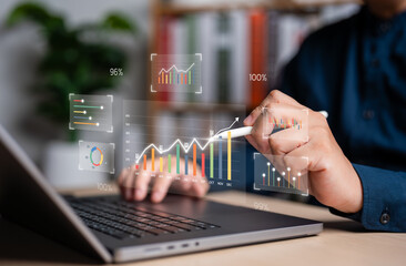 Businessman analyzing financial charts and growth statistics on a digital glass effect display. Ideal for data visualization, business intelligence, and market success in a modern office setting.