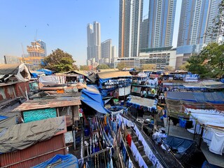 Dhobi Ghat open-air laundry district with high-rise skyline in Mumbai, Maharashtra, India.
