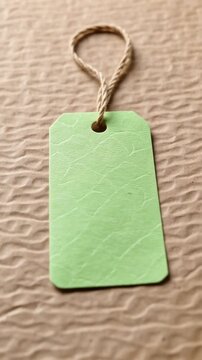 Pastel eco packaging tag textured craft paper background with natural rope minimal design and soft light creating calm organic mood for blank label or gift branding sustainable style and recycled