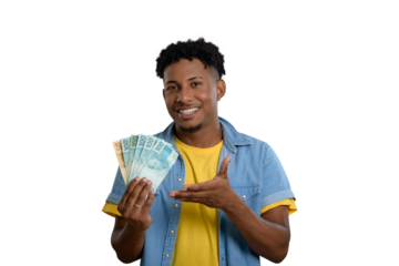 A happy young man holding Brazilian real banknotes and smiling.