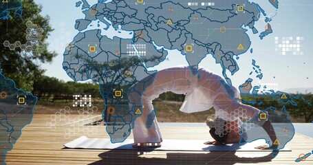Practicing woman holding deep backbend on deck, on yoga mat, wearing white outfit with data overlay