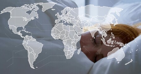Lying adult female resting on pillow in bedroom, white sheet showing world map overlay, copy space