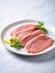 Fototapeta premium Sliced cured meat arranged on a white plate with fresh lemon wedges and parsley. Ideal for gourmet dishes and culinary presentations.