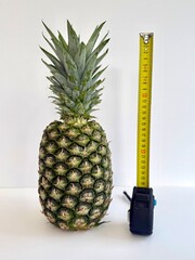 pineapple and measuring tape