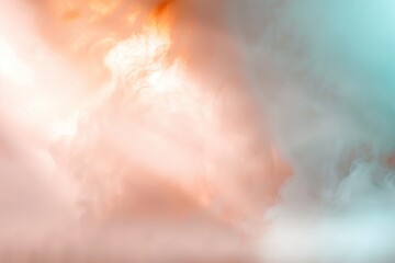 A soft gradient haze appears in the background, blending warm and cool colors. Light clouds float above the horizon at sunset, creating a gentle effect in the sky