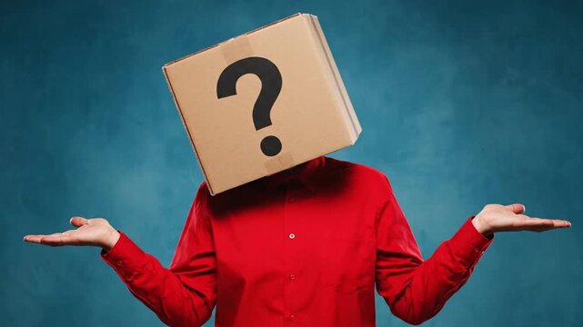 Man Wearing Cardboard Box with Question Mark on Head Shrugging Shoulders in Confusion