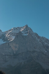 Mountain peak with snow under a clear blue sky at Gro&szlig;er Ahornboden in the Karwendel Mountains, Austria
