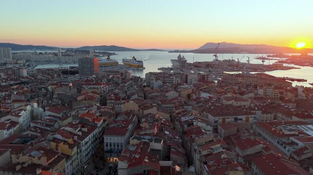 Early Sunrise Over Bustling Port, Daybreak Casts Light On Harbor With Ships And Ancient Architecture. Toulon. France