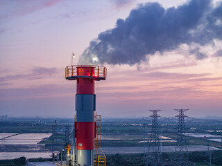 Naklejka premium aerial view power station during sunset