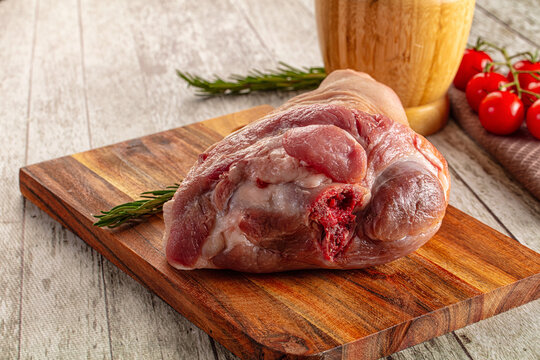 Raw pork knuckle over board