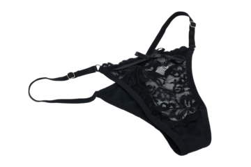 Women's sexy black thong panties on a white background. 