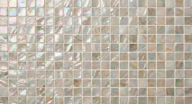 Seamless texture of square mother of pearl mosaic tiles with iridescent pink and white reflections