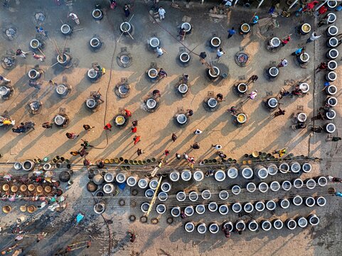 Faridpur, Bangladesh, January 12, 2026 -- Volunteers prepare meals on thousands of stoves during the annual Urs at the World Zaker Manzil shrine in Faridpur.