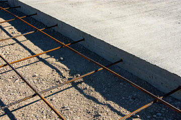 Steel reinforcement rod anchored into concrete slab. © Tom Williams