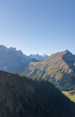 Fototapeta premium Aerial Mountain Landscape with Autumn Forest and Clear Blue Sky, Großer Ahornboden, Austria